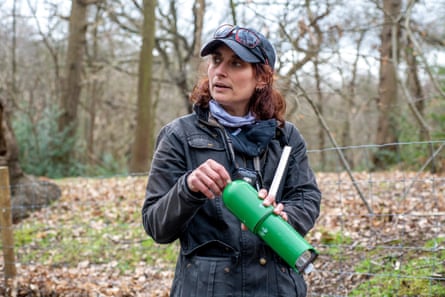 Ecologist Huma Pearce listens to the woodland sounds in Lesnes Abbey Wood in south-east London