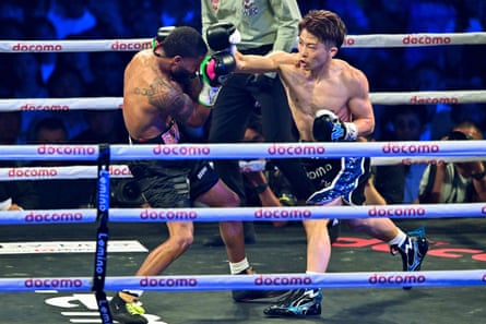 Naoya Inoue, right, lands a blow on Stephen Fulton during their world title fight on Tuesday in Tokyo.