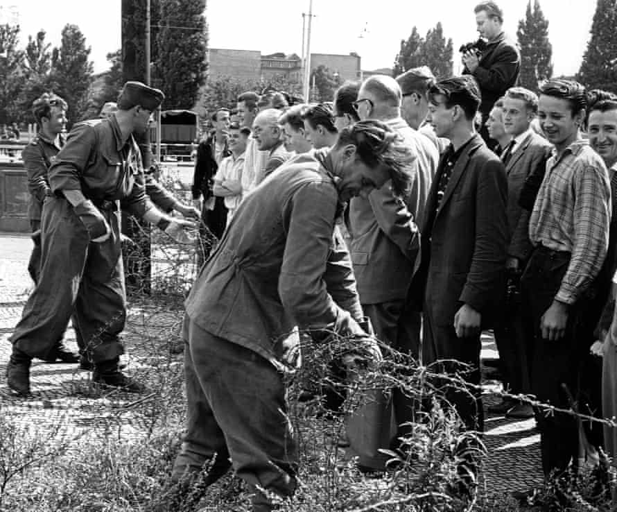 East German soldiers set up barbed wire barricades in Berlin on 13 August 1961