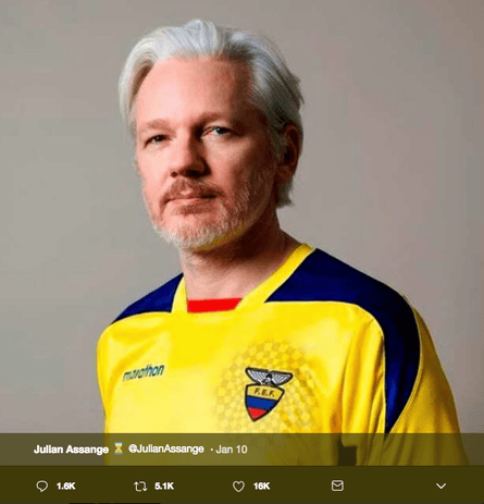 Julian Assange wearing an Ecuadorian football shirt