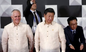 Turnbull and China’s president Xi Jinping stand together while waiting for other leaders during a family photo at Apec.