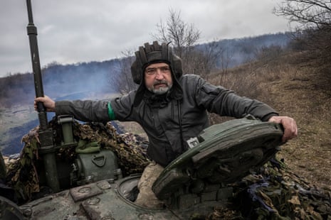 Soldiers of the 214th Battalion test drive tanks in preparation for battle in Donetsk.