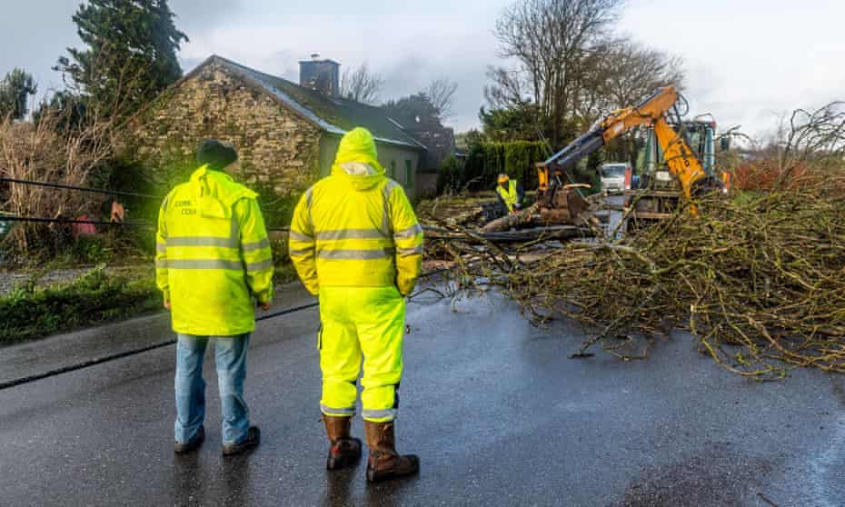 Workers help to clear the road and restore power in Timoleague, West Cork.