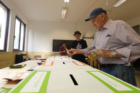 An elector votes at a polling station in Rome.