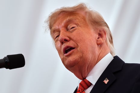 Trump speaking on stage.