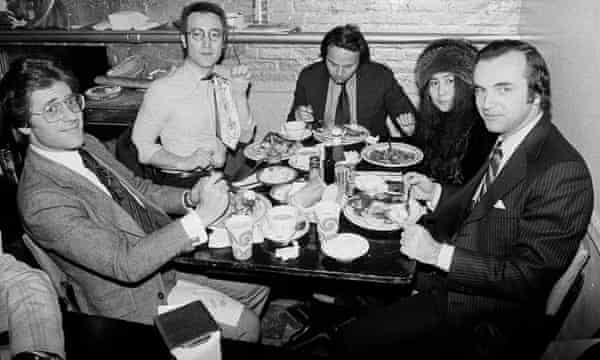 John Lennon, second from left, with lawyer Jay Bergen, right, at a lunch during the trial.