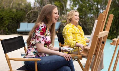 Chelsea (left) and Hillary Clinton sitting at easels, painting, in Gutsy.