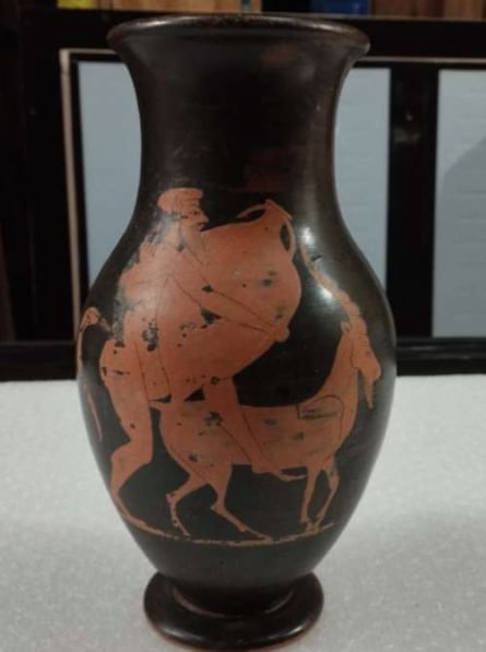 The figures of a satyr and goat were added to an authentic black-glazed vase in the 1990s