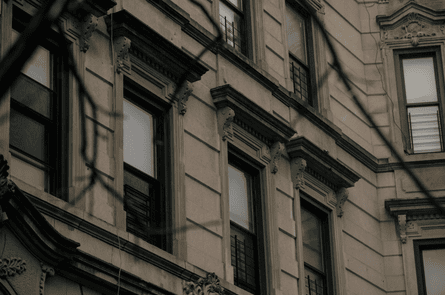 Detail of a brownstone building facade