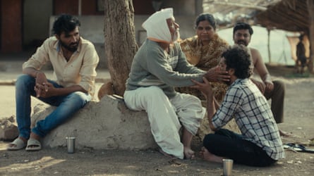 Anand talks with his mother and grandfather