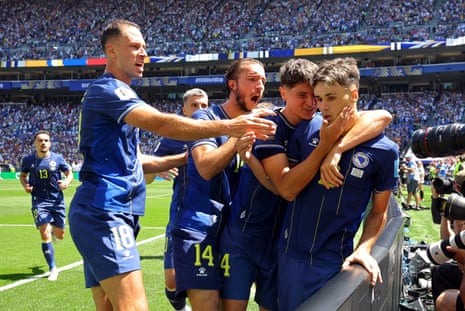 Bosnia and Herzegovina's Kerim Alajbegovic celebrates scoring their first goal with teammates.