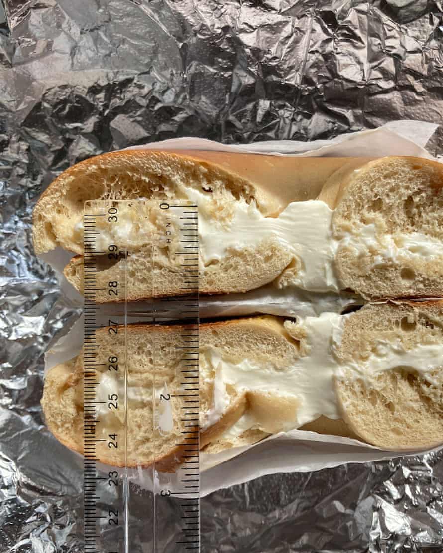 A bodega bagel with half an inch of cream cheese.