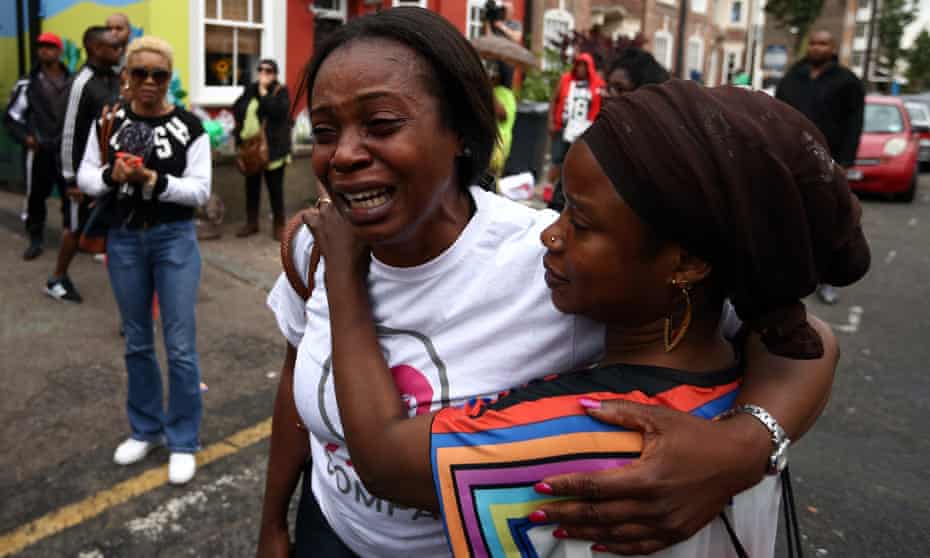 A woman is comforted outside the Kids Company in Camberwell, London after the charity’s founder<br>Camila Batmanghelidjh announced its closure