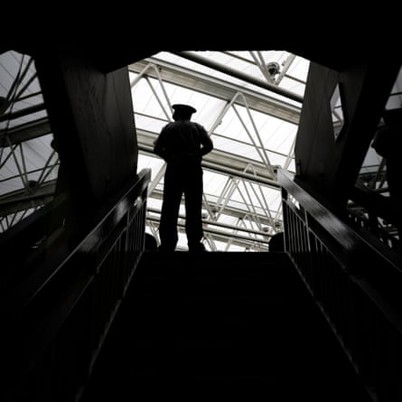 Tom Jenkins’ best shots of Wimbledon 2022 – in pictures | Wimbledon 2022 17 A service steward guards an entrance to Centre Court as the roof is shut.
