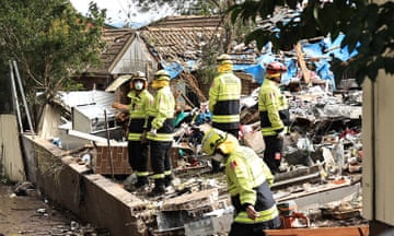 Fire and Rescue personnel work at the scene after the explosion of a townhouse in Whalan, in Sydney's west, on Sunday