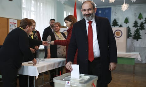 Acting Armenian Prime Minister Nikol Pashinian casts his ballot in a polling station during an early parliamentary election in Yerevan, Armenia.