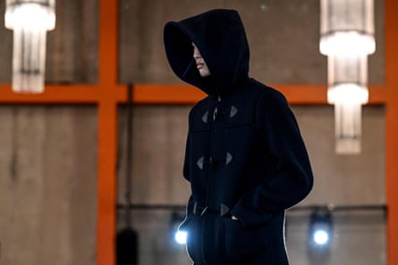 A model presents a creation based on a duffel coat design by Prada.