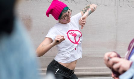 Taylor Benac dances in a pink ‘pussyhat’