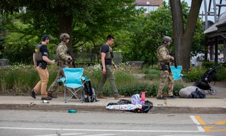 Police walk past some of the items abandoned after the crowd fled.
