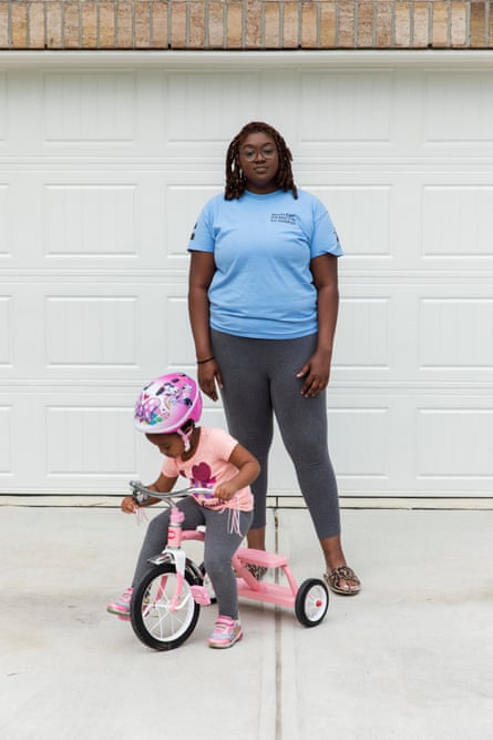 Kyler Daniels, 27, outside her home with four-year-old daughter, Nova, in Rocky Mount, North Carolina.