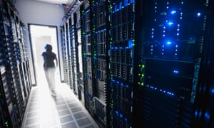 A woman in a room of servers
