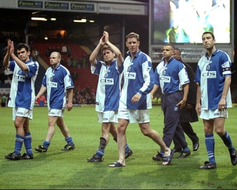 Blackburn Rovers players applaud the fans after being relegated in 1999.