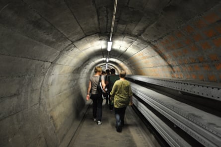 A group walks through a tunnel
