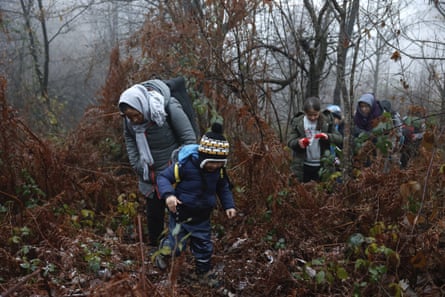 A group of migrants in a Croatian forest after crossing the Bosnia-Croatia border near the town of Velika Kladusa, in December 2020.
