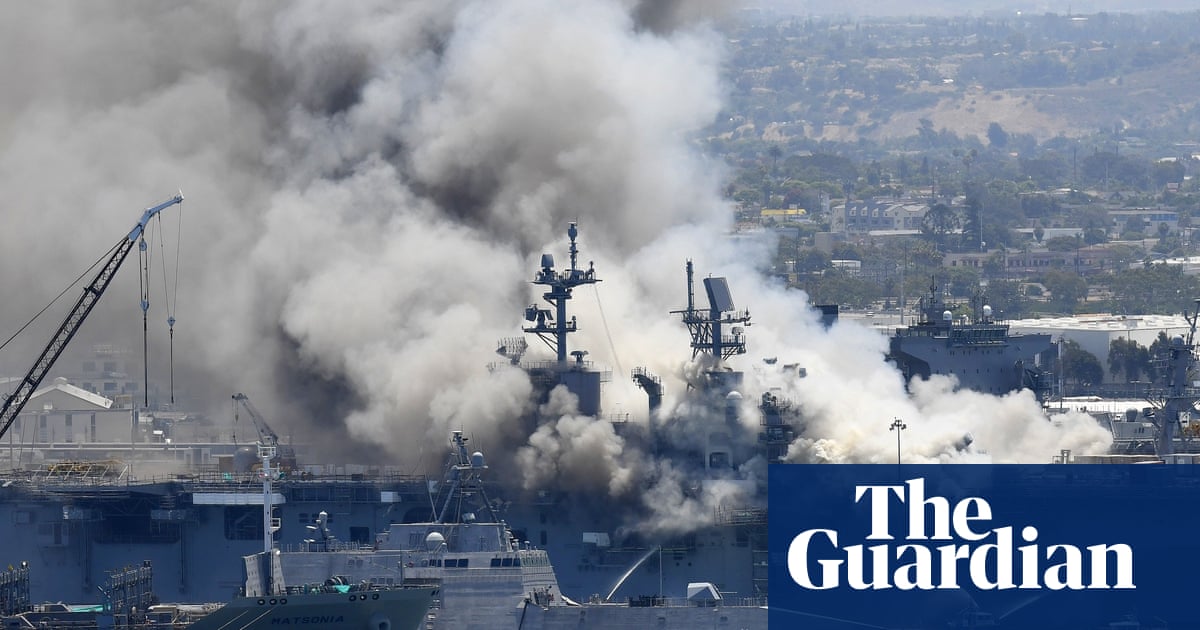 Sailor charged over fire that destroyed US warship ‘disgruntled’, prosecutors say