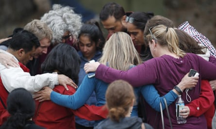 Stem school parents gather in a circle to pray after a shooting at the Highlands Ranch school.
