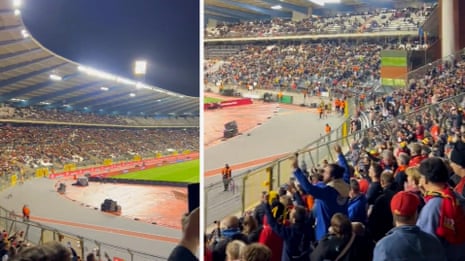 'All together': football fans at Belgium v Sweden chant after Brussels shooting – video