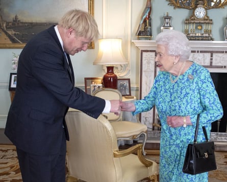 Boris Johnson bows as he shakes hands with the queen