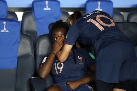 Amel Majri of France consoles teammate Griedge Mbock Bathy following France’s defeat in the quarter final by USA at Parc des Princes.