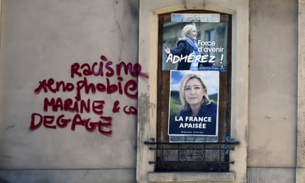 Graffiti on a FN campaign office reading ‘Racism, xenophobia, Marine and co, clear off!’