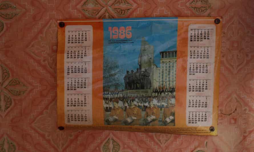 A calendar is seen on the wall in a house in the abandoned village of Zalissya near the Chernobyl nuclear power plant.