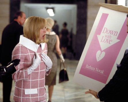 A still from Down with Love showing a shocked Renee Zellweger wearing a pink outfit with a white grid pattern print
