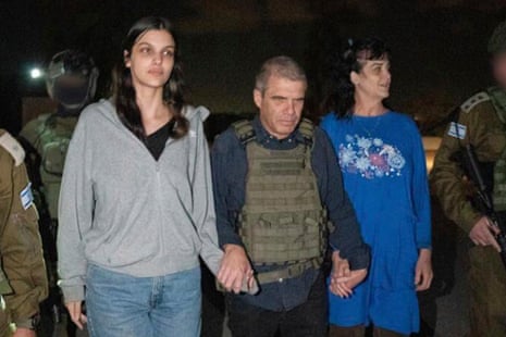 Seventeen-year-old Natalie Raanan and mother Judith are escorted by Israeli officials after they were released by Hamas after two weeks of captivity in Gaza. 