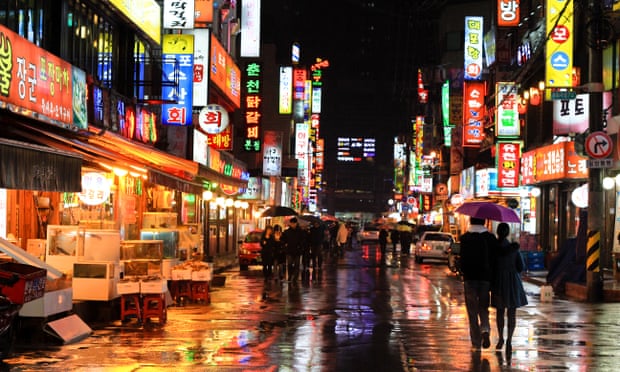 A street in Seoul at night.