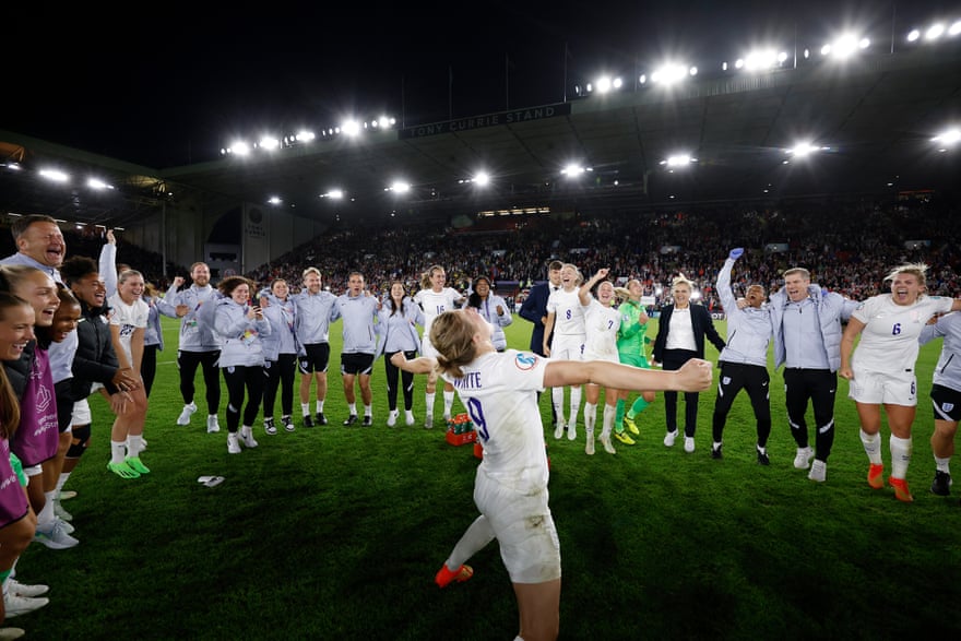 Ellen White of England celebrates in the middle of a team huddle as England celebrates their side’s semi-final victory over Sweden.