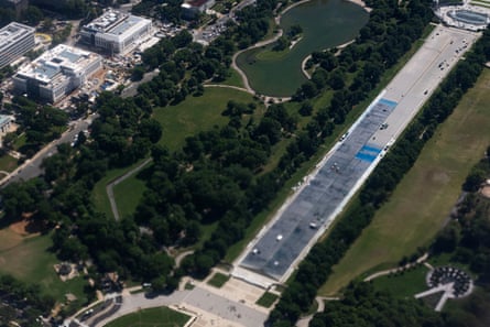 Aerial view of long strip of land after pool drained