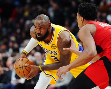 LeBron James's 18-year double-digit scoring streak ends but Lakers clinch win over Raptors | LeBron James | The Guardian