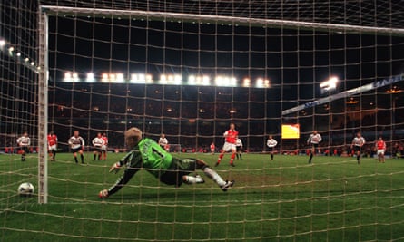 Dennis Bergkamp has a penalty saved by Peter Schmeichel.