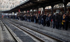 Commuters wait at Gare de l’Est train station in Paris during a strike by SNCF workers and the Paris transport network RATP as part of a second day of nationwide strikes.