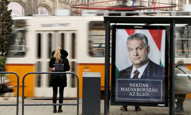 A poster featuring Hungarian Prime Minister Viktor Orbán hangs on a tram station
