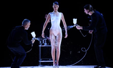 Bella Hadid is dressed by spraying spray-on fabric at Coperni fashion show last year.