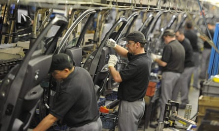 Nissan workers prepare doors for the Qashqai car in Sunderland.