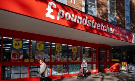 Shoppers walk past a Poundstretcher store in Stratford, east London