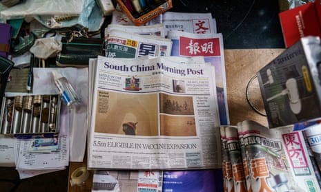 A copy of the South China Morning Post on a newsstand