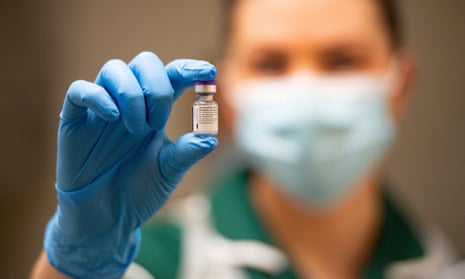 A nurse holds a vial of the Pfizer/BioNTech Covid-19 vaccine.