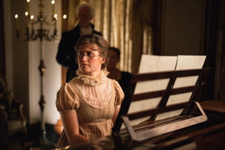 She sits at the 18th-century keyboard instrument